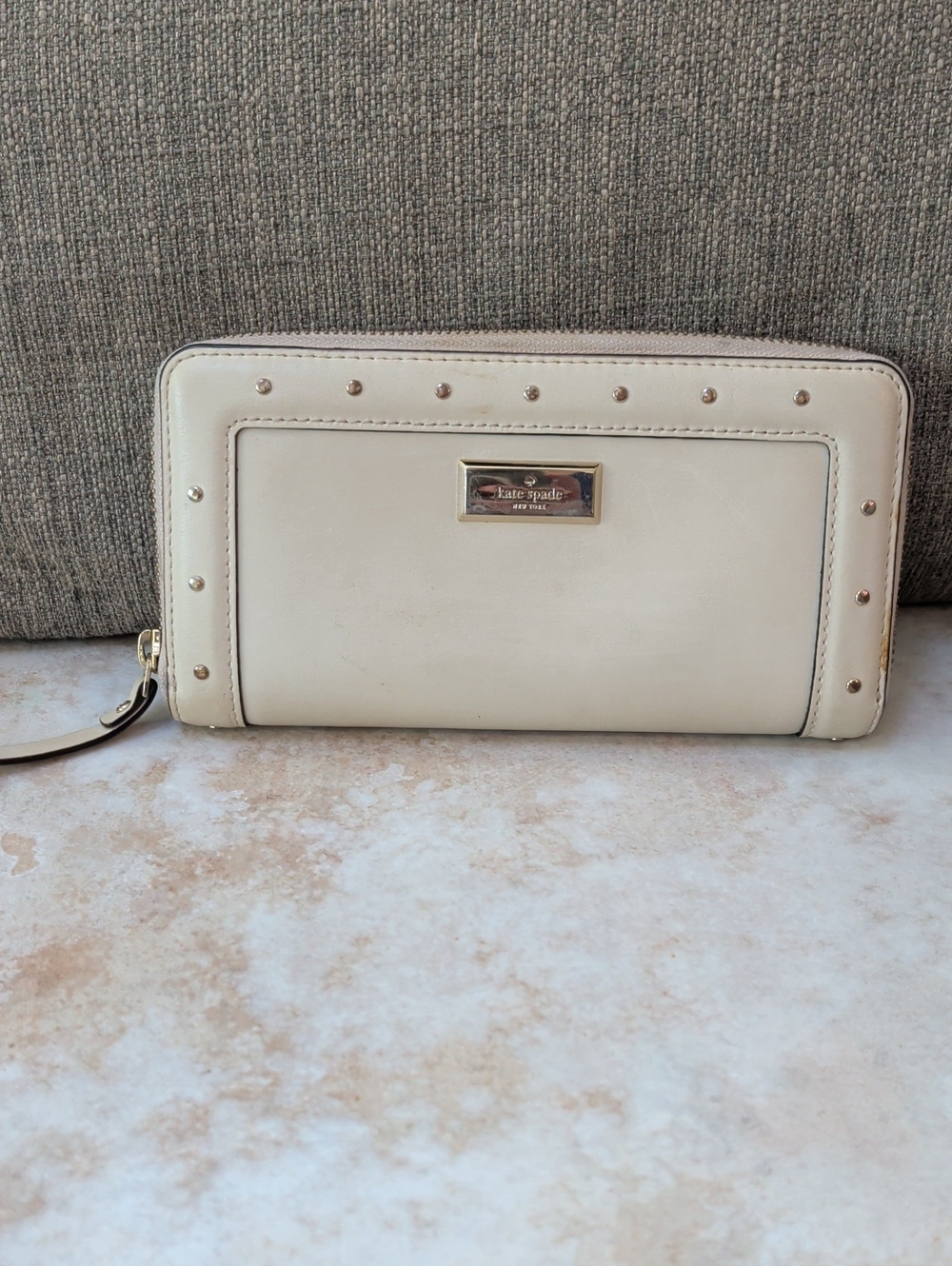 kate spade cream wristlet zip-around wallet with gold studs